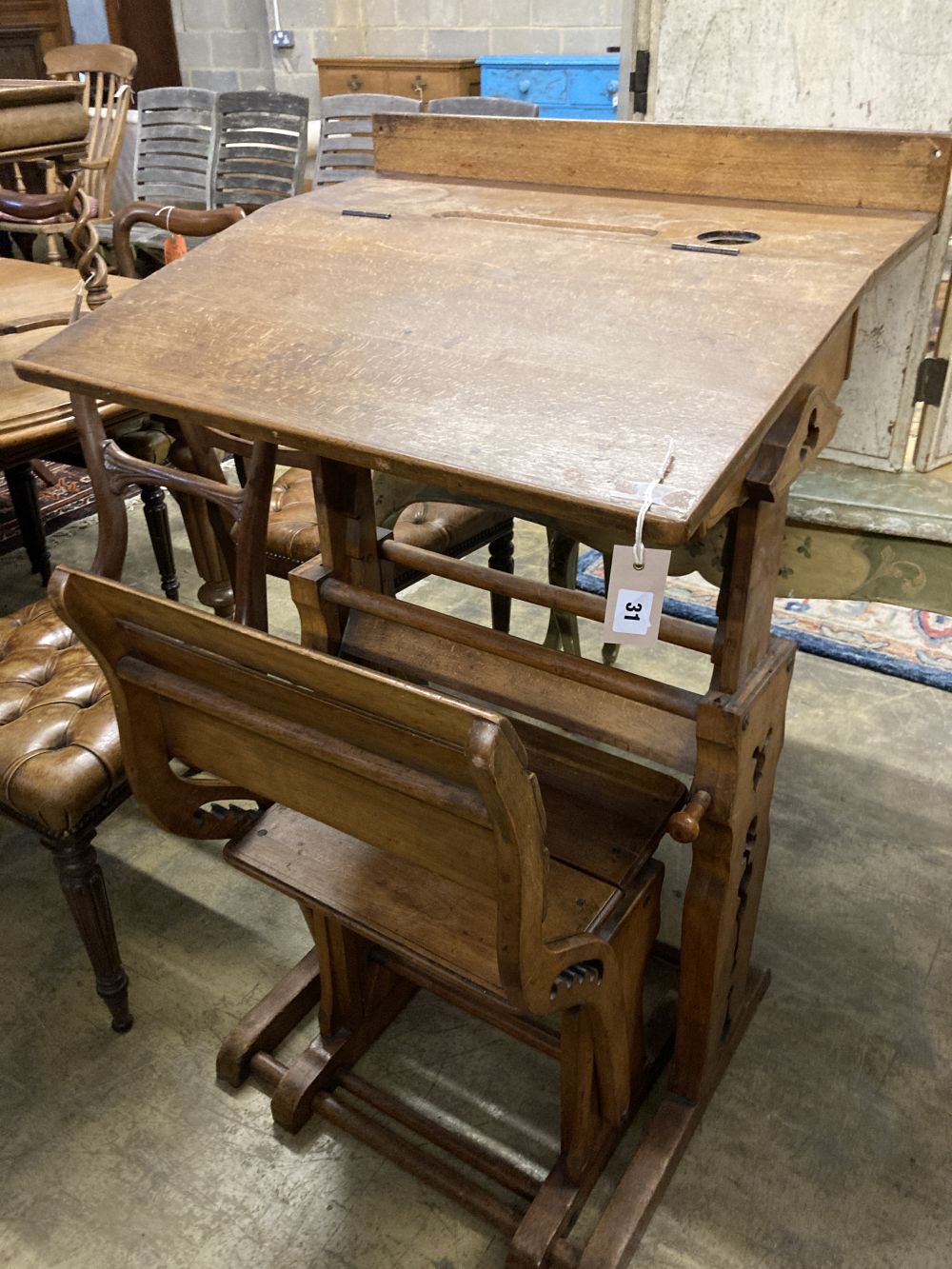 A 19th century Continental oak metamorphic rise and fall students desk together with a matching chair, desk width 66cm